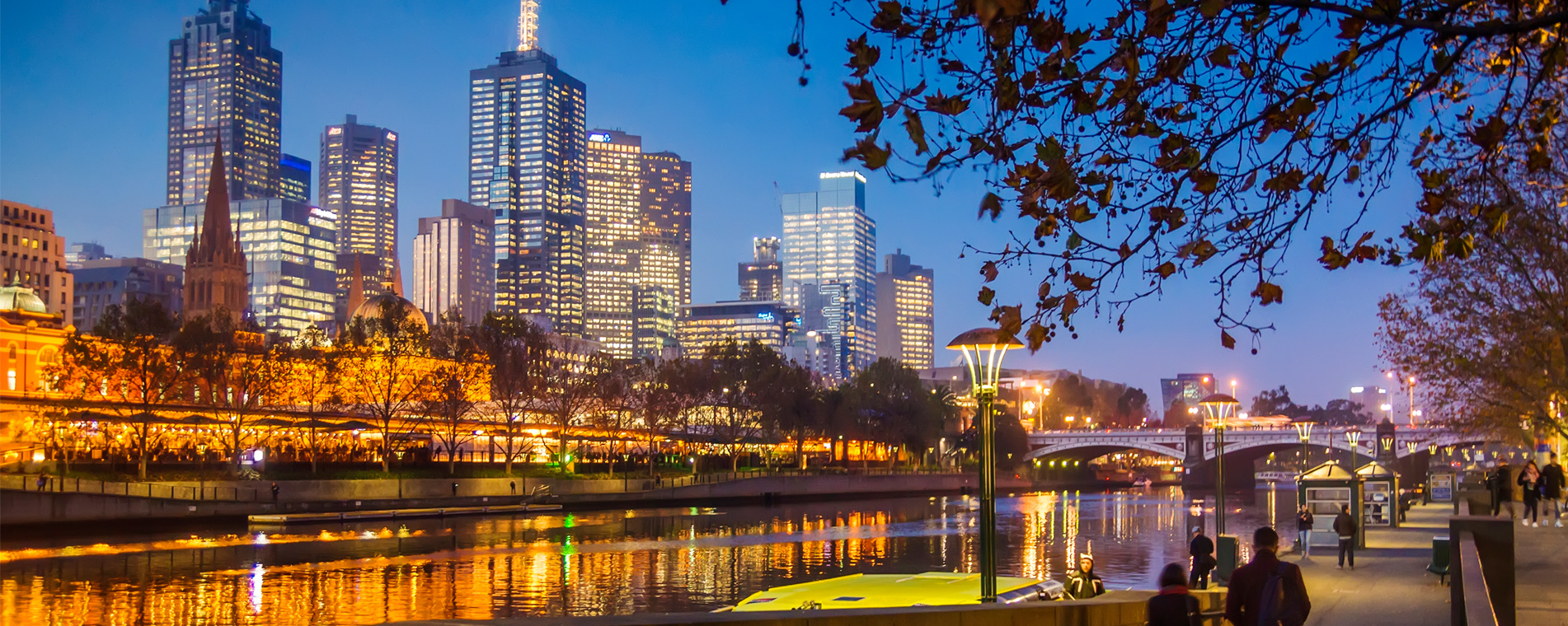 Melbourne city lights reflected in the Yarra River at dusk